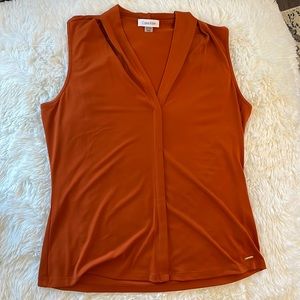 Calvin Klein top. Size Medium. Orange. Never Worn.